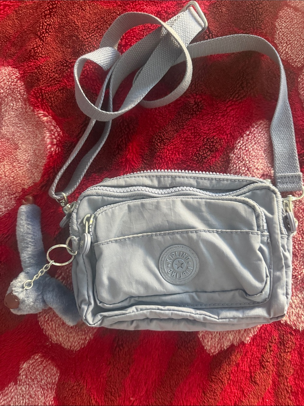 Kipling blue Crossbody with Plush Monkey Charm